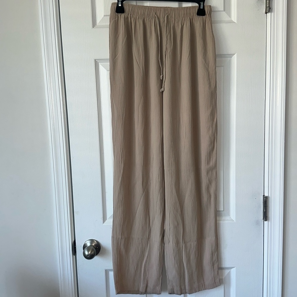 CLIO tan women pants pulled up size medium tall bootcut good condition